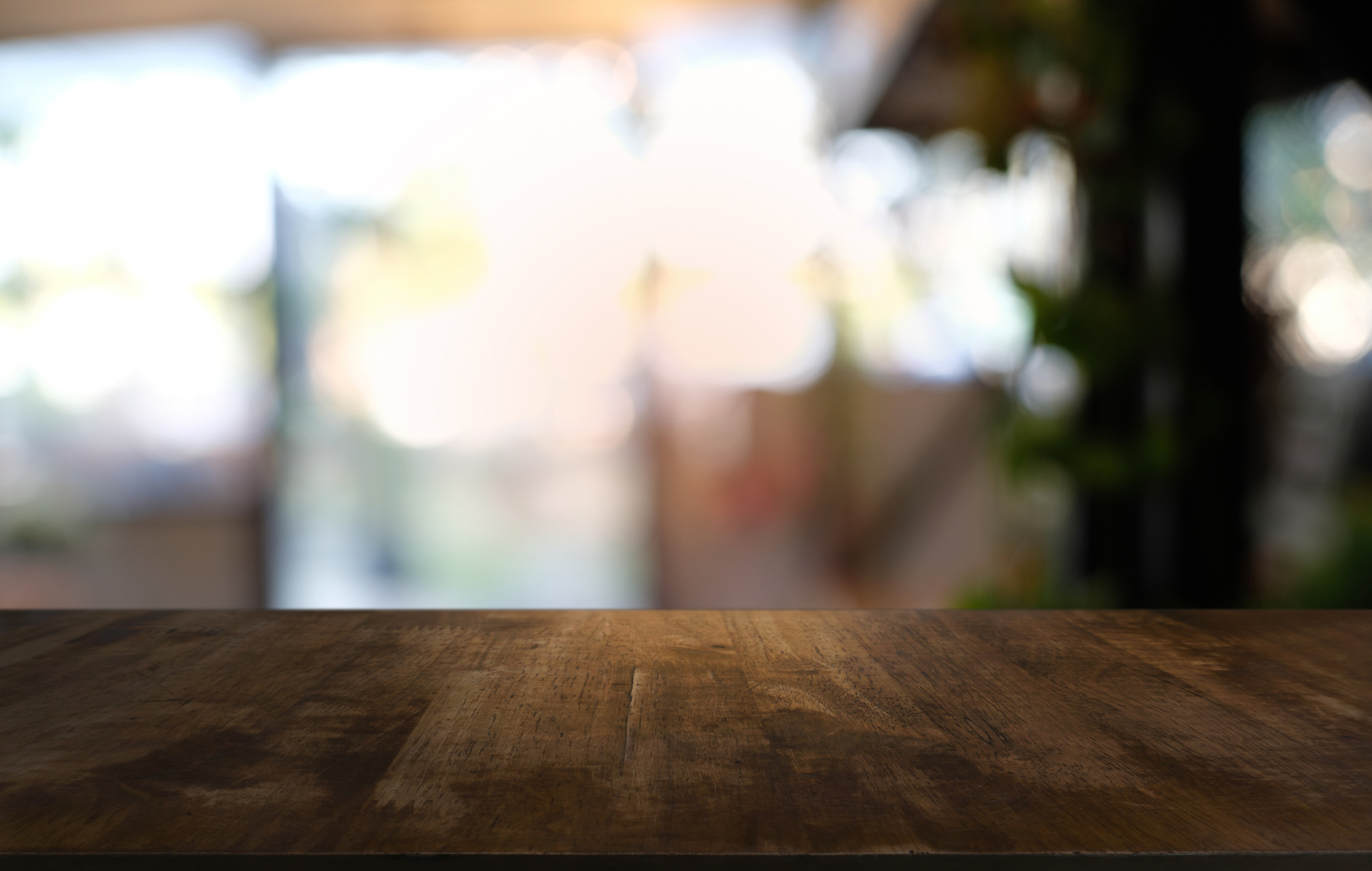 Empty Dark Wooden Table in Front of Abstract Blurred Bokeh Backg